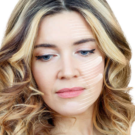 Graphic lines shows facial lifting effect on skin of beautiful woman.の写真素材