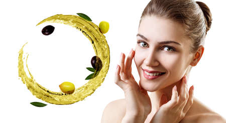 Young beautiful woman near circulate splash of olive oil.の写真素材
