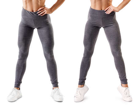 Workout in the gym. Womans muscular legs in leggings and sneakersの写真素材