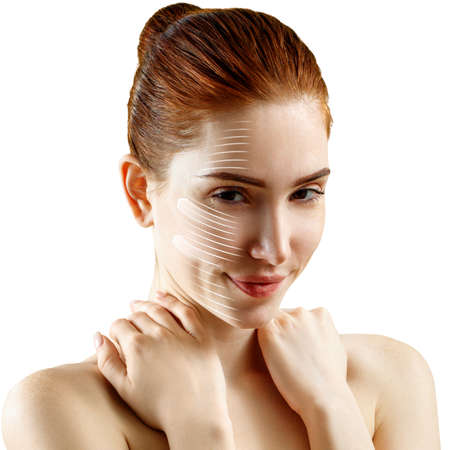 Face lift anti-aging lines on smiling woman face.の写真素材
