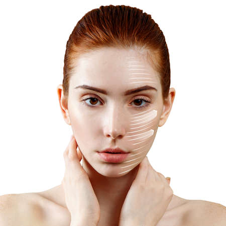Face lift anti-aging lines on woman face.の写真素材