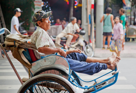 Resting cyclo driver in Vietnam