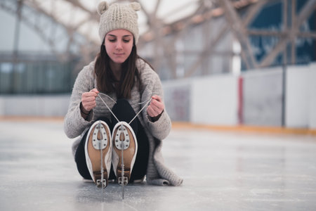 Pretty young woman at ice-skating rink.