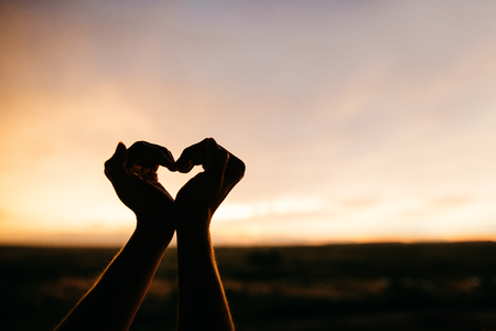 Woman hands making a heartの写真素材