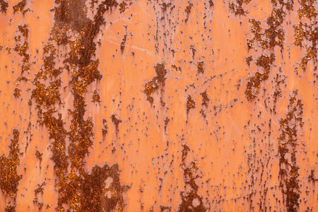 metal surface covered with rust and corrosion from the effects of moisture and air
