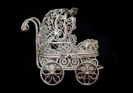 Antique toy baby carriage isolatedの写真素材