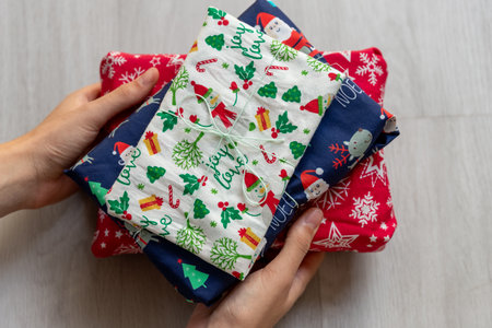 holding gift zero waste wrapped in fabricの写真素材