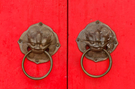 Ancient architecture and door knocker, Red wooden door, Chinese styleの写真素材