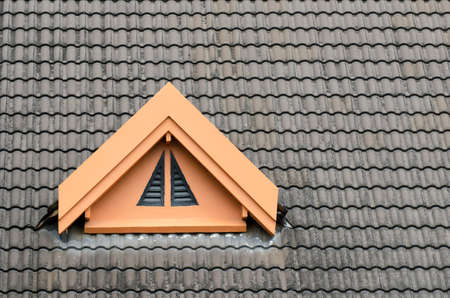 Roof tile dark gray roof ventilation window.の写真素材