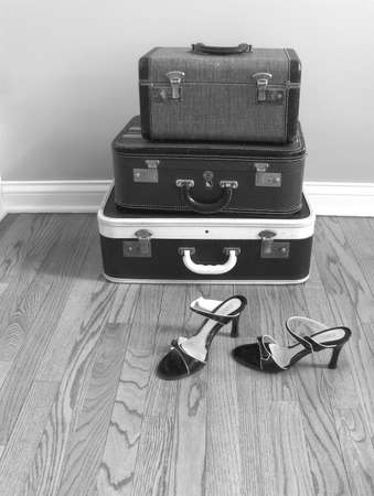 vintage suitcase with women's shoes, black and whiteの写真素材
