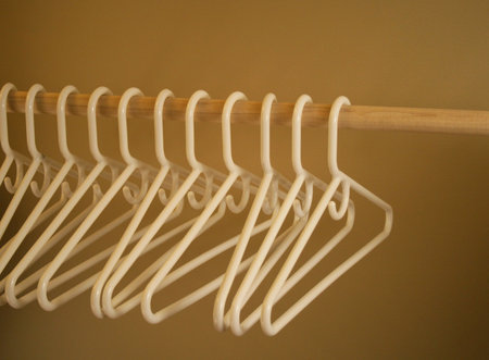 neat row of matching white hangers