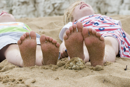 little feet on the beachの写真素材