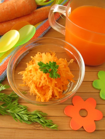 Carrot juice and raw carrot mash for childrenの写真素材