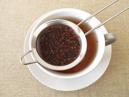 Honey bush tea in tea strainerの写真素材