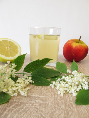 Freshly made lemonade with elderflowers, apple juice and lemonの写真素材