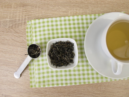 Cup of chinese tea white monkeyの写真素材