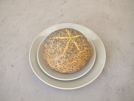 A poppy seed roll on a plateの写真素材