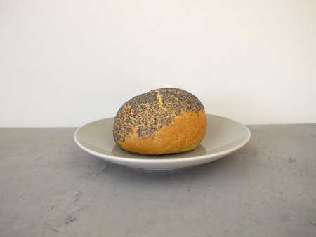A poppy seed roll on a plateの写真素材