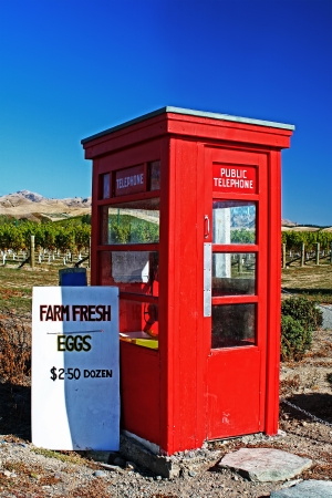 Iconic British, red telephone box in rural New Zealand, used for selling eggs  Shot in Marlborough New Zealand のeditorial素材