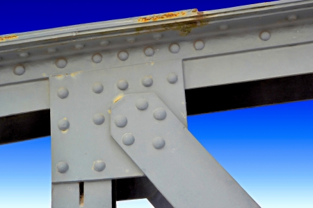 Steel structure of an old bridge in Magdeburg and blue skyの写真素材