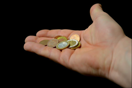 a hand with money paid