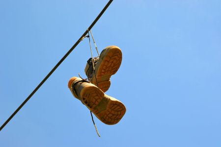 Hanging shoes on a power cable in Magdeburgの写真素材