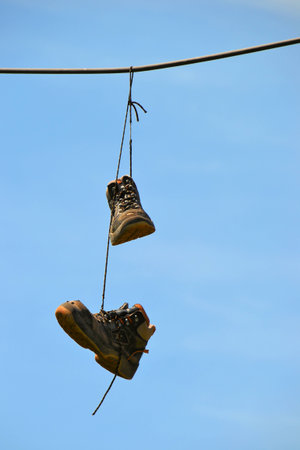 Hanging shoes on a power cable in Magdeburgの写真素材