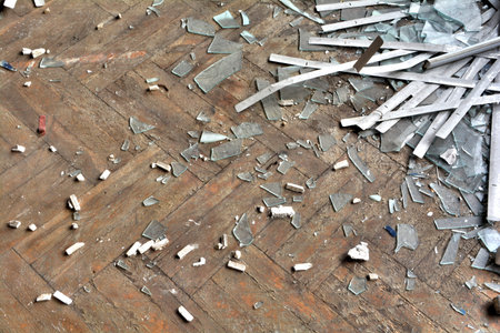 Broken glass on a parquet floorの写真素材