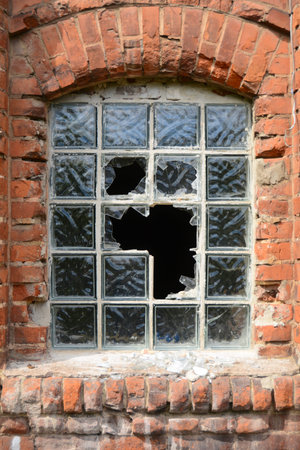 Destroyed window in a disused factory
