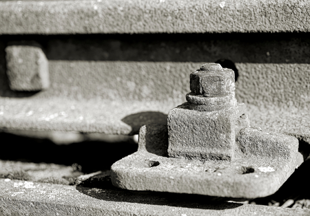 old rusty screw on a railway trackの写真素材