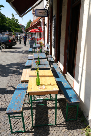 BERLIN, GERMANY, MAY 10, 2016: Street Cafe with no guests in Berlin-Kreuzberg.のeditorial素材