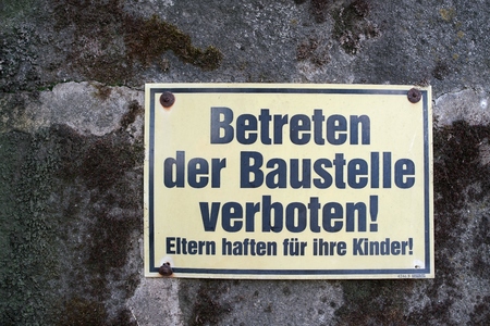 Sign at a construction site with the words "Entry to the Construction Site is forbidden"の写真素材