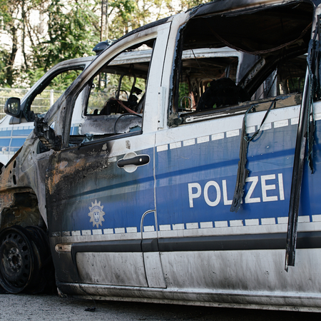 MAGDEBURG, GERMANY â  "September 8, 2016: Burnt-out cars after on of arson attack on police cars in the center of Magdeburg 08.September 2016のeditorial素材