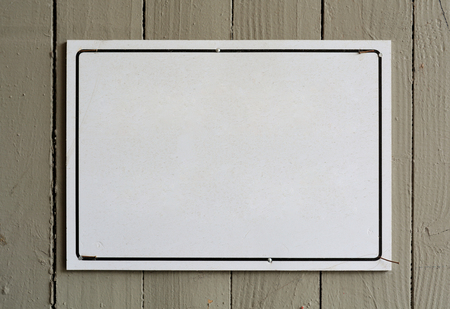 blank white sign on a garage doorの写真素材