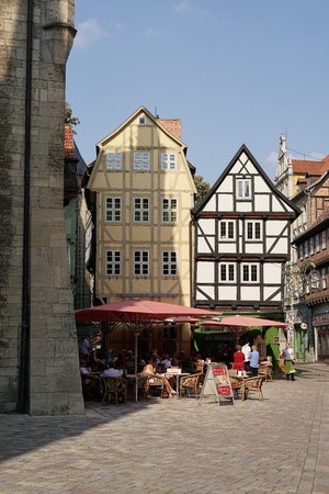 QUEDLINBURG, GERMANY - SEPTEMBER 10, 2016: Tourists in a cafe in the old town of Quedlinburg. Due to the historic buildings Quedlinburg is one of the most popular cities in the Harzのeditorial素材