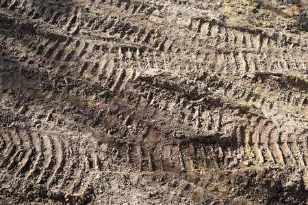 ire tracks of construction vehicles on a construction site.