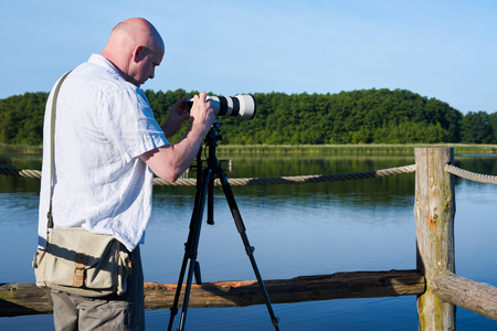 Photographer on a lake in the Mueritz National Park in Germanyの写真素材