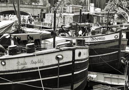 BERLIN, GERMANY - MAY 19, 2015: old discarded cargo ships on its mooring on the fishing island in Berlinのeditorial素材