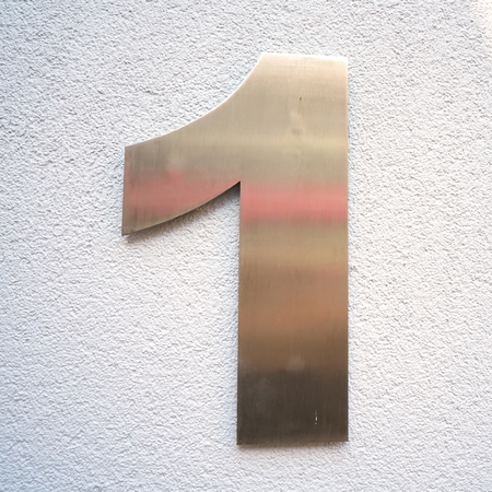 House number "1" on the facade of a houseの写真素材