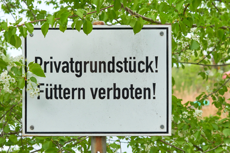 Sign with the inscription "private property, feeding forbidden"の写真素材