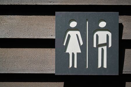 Symbols for man and woman in a public toiletの写真素材