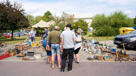 MAGDEBURG, GERMANY - AUGUST 04, 2019: Visitors on a popular flea market in downtown Magdeburg on a...