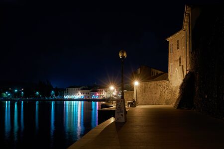 POREC, CROATIA - JULY 21, 2018: Promenade along the Adriatic Sea in the old town of Porec in Croatia at nightのeditorial素材