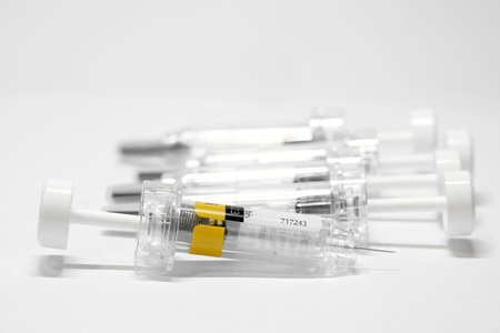 Syringe with vaccine to combat coronavirus on a table