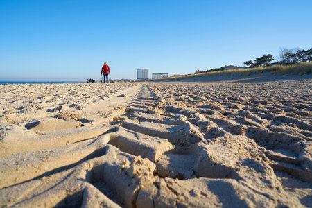 WARNEMUENDE, GERMANY - JANUARY 17, 2020: Beach of Warnemuende on the German Baltic coast. In the background the Hotel Neptunのeditorial素材