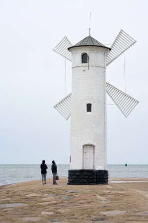 Swinoujscie, Poland - September 08, 2020: Mill beacon, the landmark of the city of Swinoujscie on the Polish Baltic coastのeditorial素材