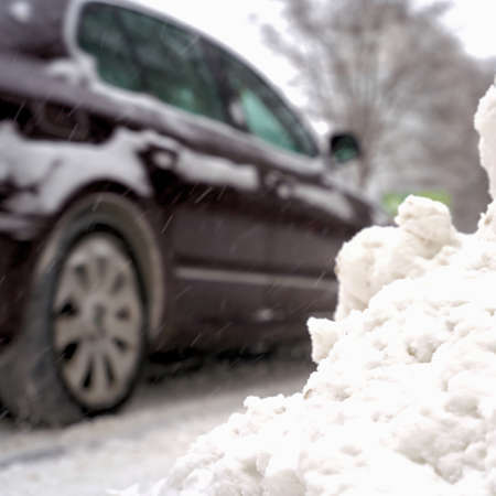 blurred car with motion blur on a slippery road in winterの写真素材