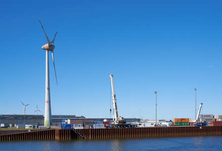 Magdeburg, Germany - March 08, 2021: Commercial port of the city of Magdeburg in the North industrial park with a wind turbineのeditorial素材