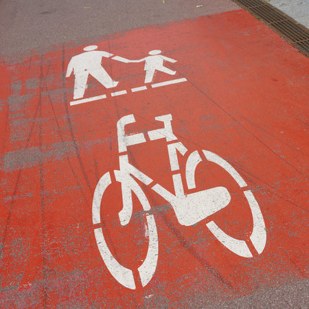 red marked path for cyclists and pedestrians in the center of Kolobrzeg in Poland