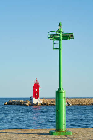 Krk, Croatia â August 06, 2021: green and red lighthouse in the entrance to the port of Krk on the Adriatic Sea in Croatiaのeditorial素材